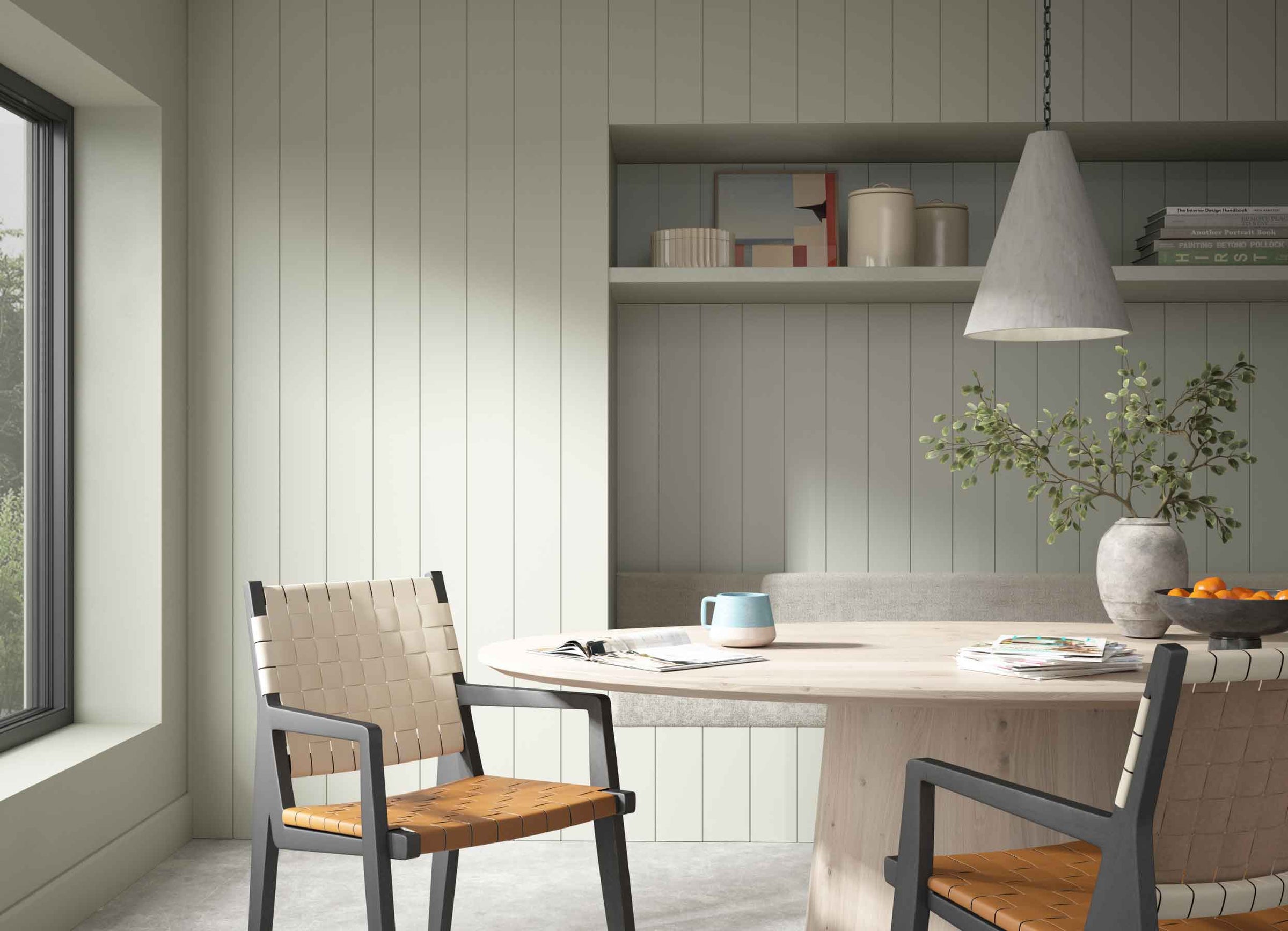 Green Tongue and Groove wall panelling in a dining room with a neutral table, two-tone woven chairs and grey accessories.