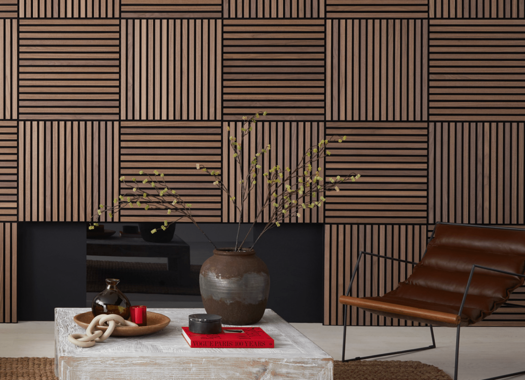 A Japandi-style living room featuring SlatWall Mini Walnut panels in alternating directions on a media wall with a fireplace.
