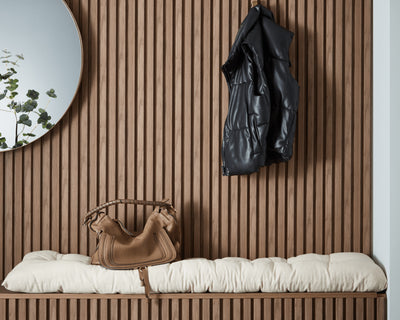Waterproof walnut panels on bench and wall behind