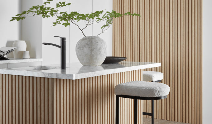 SlatWall waterproof natural oak panels around kitchen breakfast bar and in background on the wall