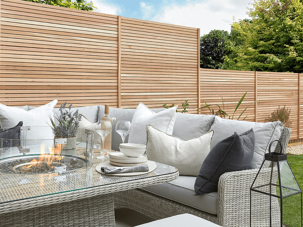 Cedar modular bundle as fence panels behind outdoor lounge area