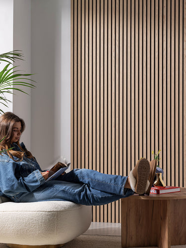 image of lady sat in front of acoustic wall panels 