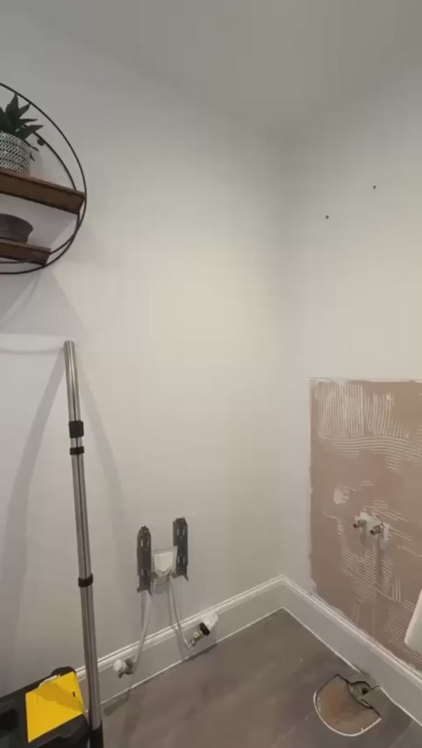 image of person installing shower panels in theri bathroom 