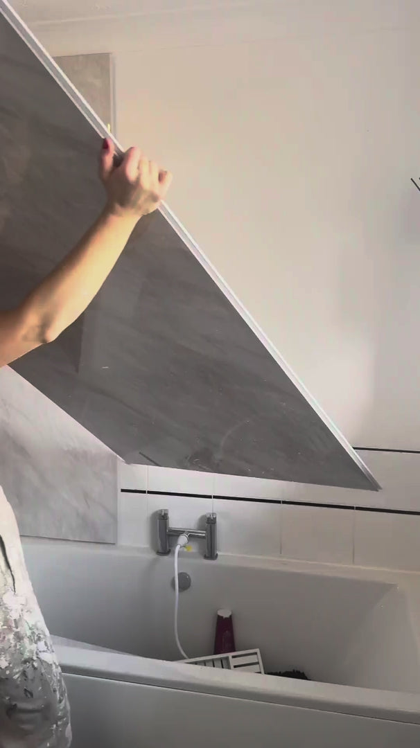 image of person installing shower panels 