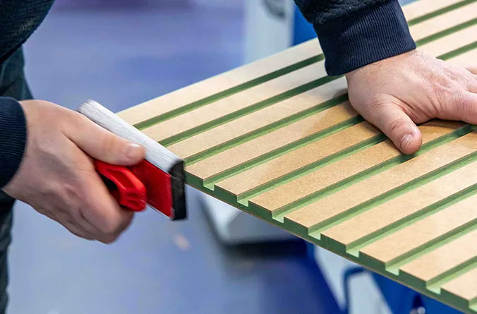 person sanding down an mdf panel 