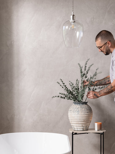 image that shows person next to natural stone sivara pvc panel 
