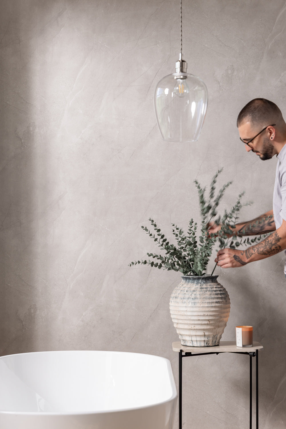 image that shows person next to natural stone sivara pvc panel 