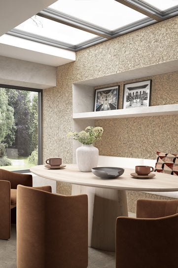 Roomset image showing Lagos Beige cork tiles on wall behind dining areas. Leather armchairs and light wood table.