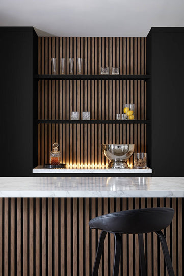 Home Bar setting using SlatWall Waterproof in Walnut and Black colours, creating a modern decor.