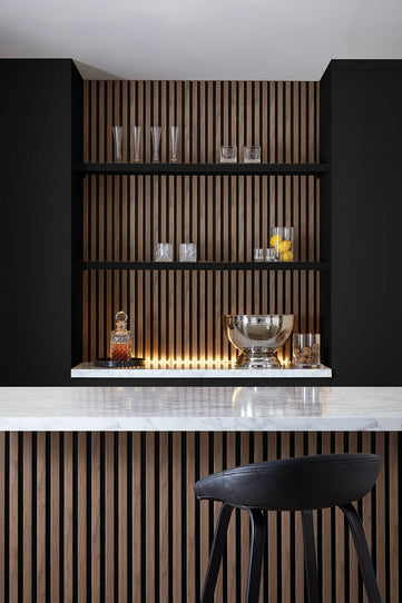 Home Bar setting using SlatWall Waterproof in Walnut and Black colours, creating a modern decor.