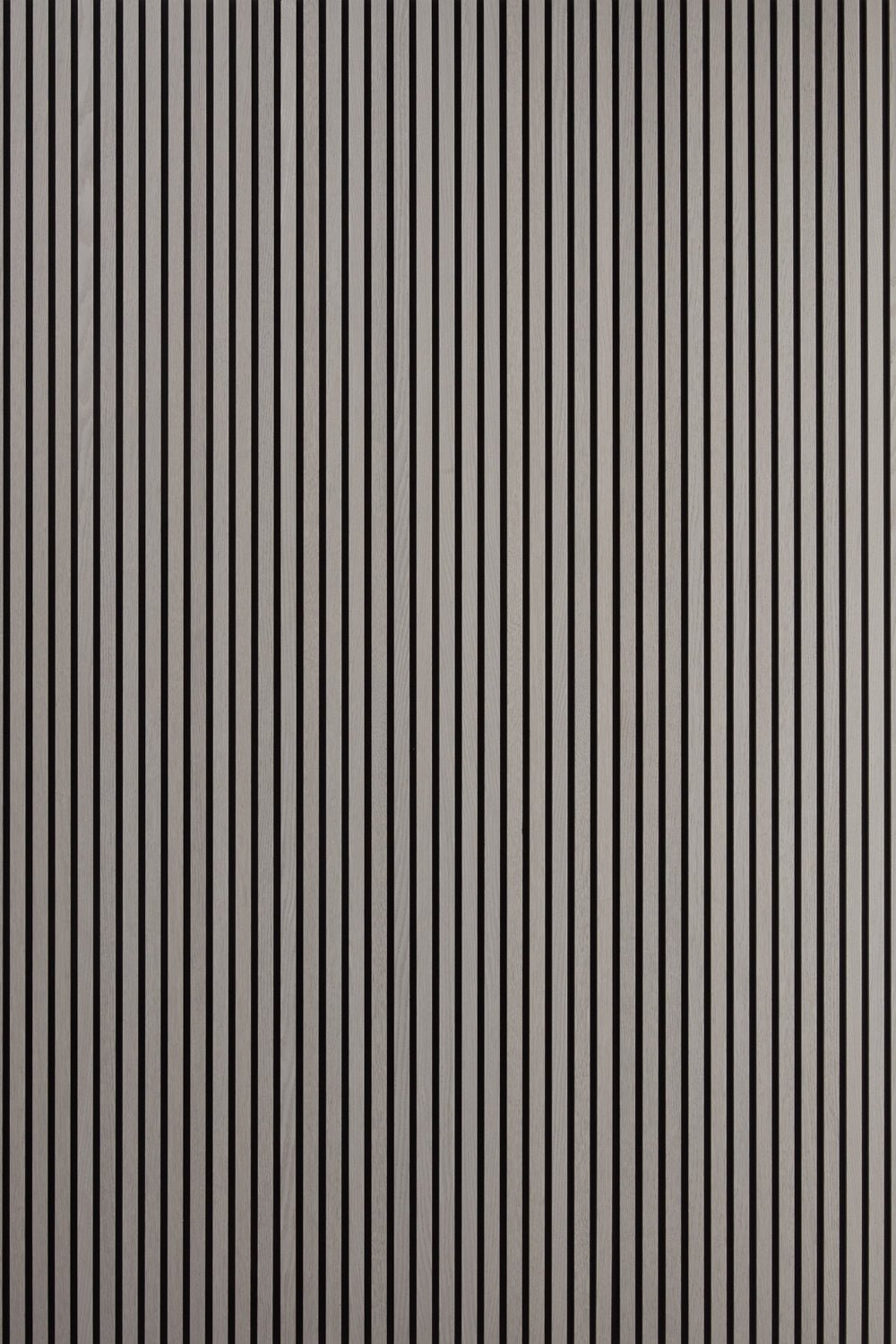 A display of three Grey Oak Acoustic SlatWall Panels from Naturewall, on felt backing.
