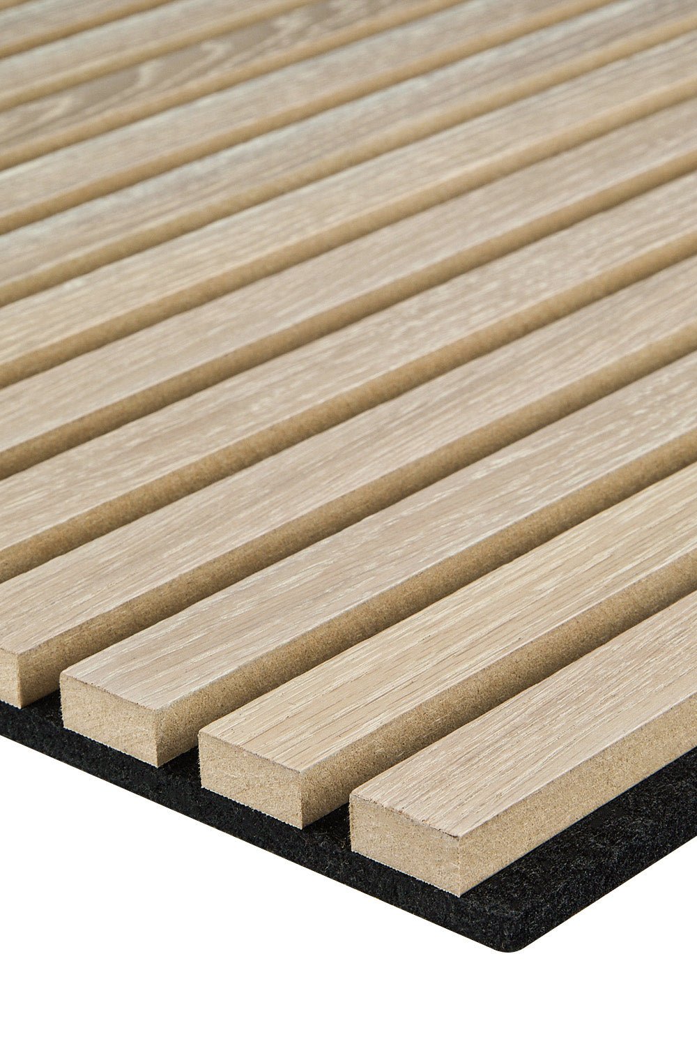 The corner of a SlatWall wall panel in washed oak colour on a black felt backing